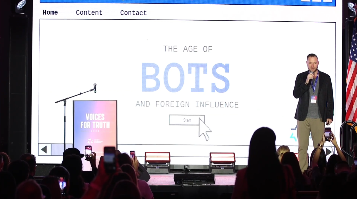 Travis Hawley delivering The Age of Bots and Foreign Influence keynote at Voices for Truth